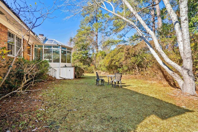 view of yard with a lanai