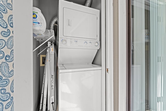 washroom with stacked washer / drying machine