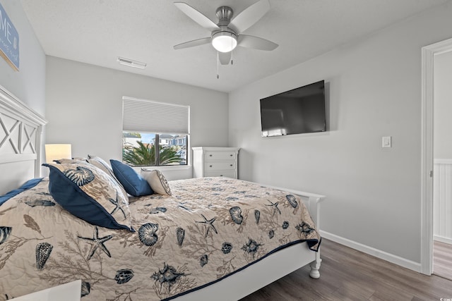 bedroom featuring hardwood / wood-style floors and ceiling fan