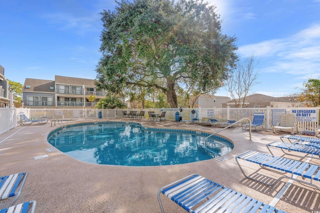 view of swimming pool featuring a patio