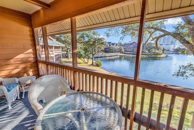 wooden terrace with a water view