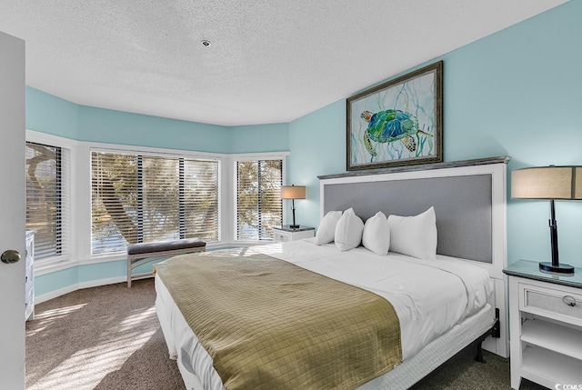 carpeted bedroom featuring a textured ceiling