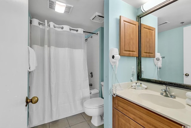 full bathroom with vanity, tile patterned floors, shower / bath combo with shower curtain, and toilet