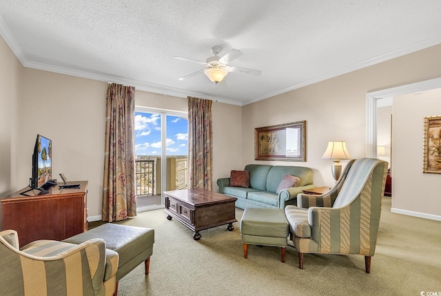 living room with ceiling fan, light colored carpet, ornamental molding, and a textured ceiling