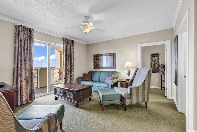 carpeted living room featuring ceiling fan, ornamental molding, and a textured ceiling