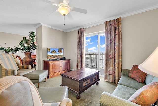 carpeted living room with ceiling fan, ornamental molding, and a textured ceiling