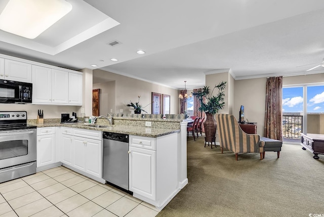 kitchen featuring kitchen peninsula, white cabinets, and appliances with stainless steel finishes