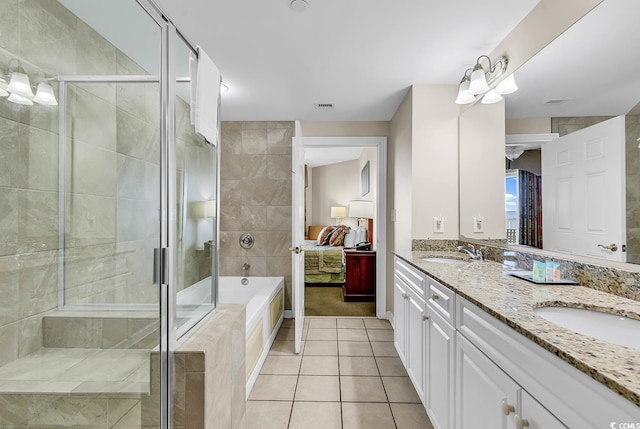 bathroom with vanity, tile patterned floors, and independent shower and bath