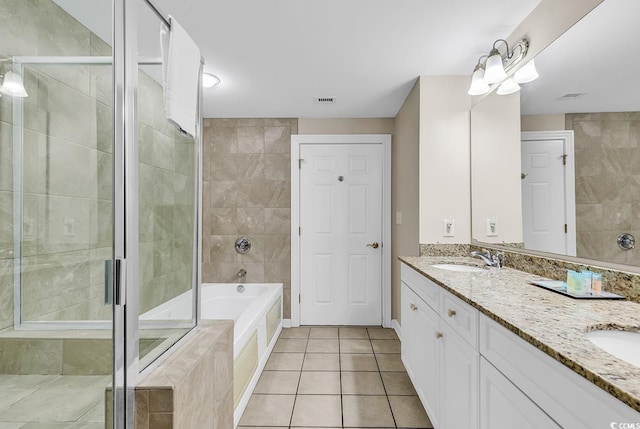 bathroom featuring vanity, tile patterned flooring, and plus walk in shower