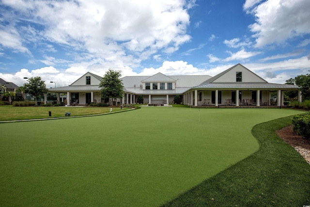 view of property's community with a lawn