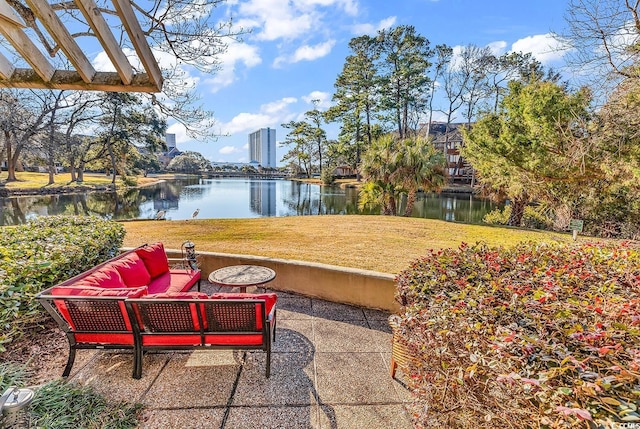 view of patio featuring an outdoor living space and a water view