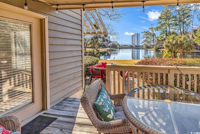 balcony with a deck with water view