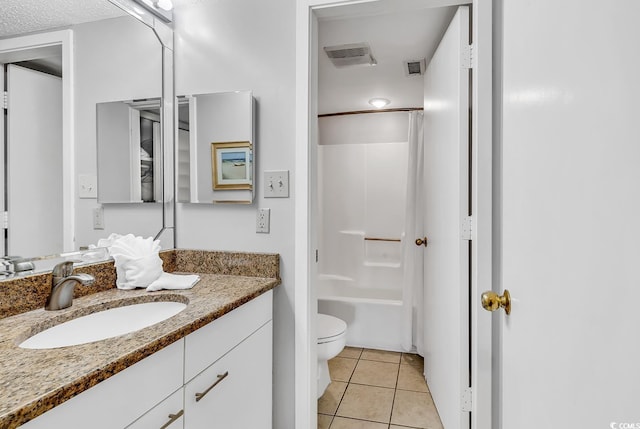 full bathroom with tile patterned flooring, vanity, bathing tub / shower combination, and toilet