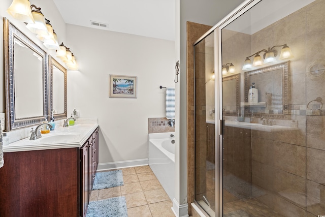 bathroom with tile patterned flooring, vanity, and separate shower and tub