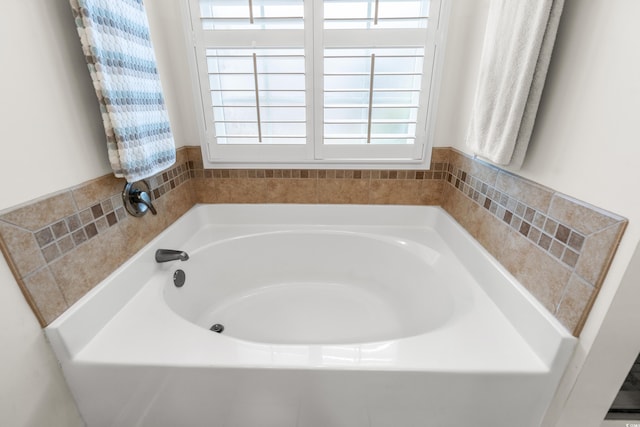 bathroom with a washtub