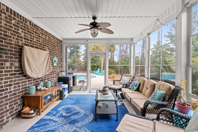 sunroom / solarium with wooden ceiling and ceiling fan