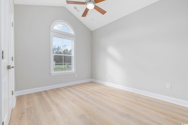 empty room with vaulted ceiling, light hardwood / wood-style floors, and ceiling fan