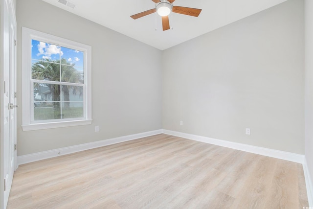 spare room with ceiling fan and light wood-type flooring