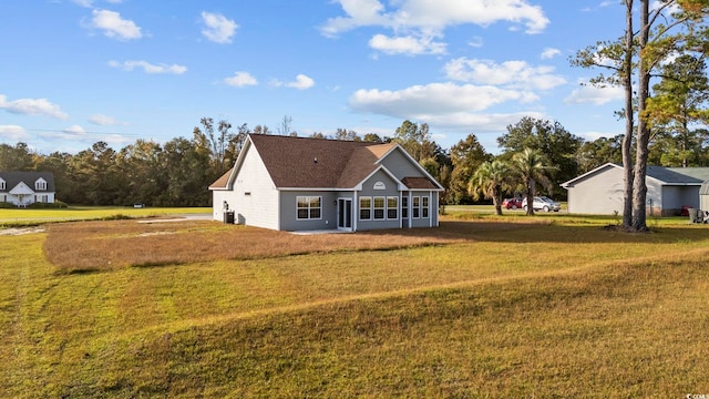 back of property featuring a lawn