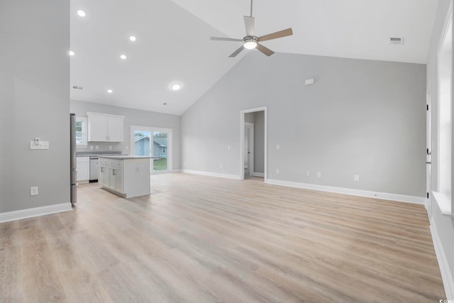 unfurnished living room featuring light hardwood / wood-style flooring, high vaulted ceiling, and ceiling fan