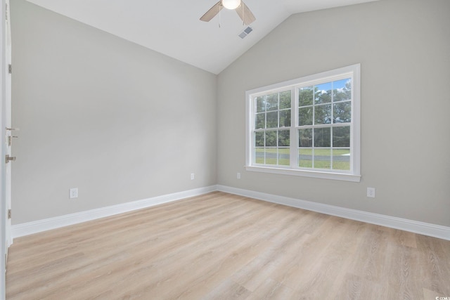 unfurnished room with vaulted ceiling, ceiling fan, and light wood-type flooring