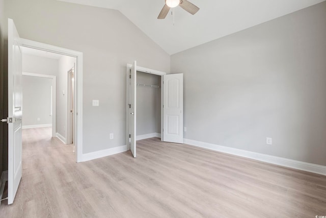 unfurnished bedroom with vaulted ceiling, ceiling fan, light hardwood / wood-style floors, and a closet