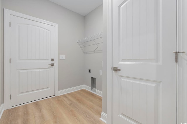 clothes washing area with light wood-type flooring and electric dryer hookup