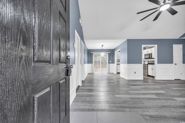 interior space featuring an inviting chandelier and dark hardwood / wood-style flooring