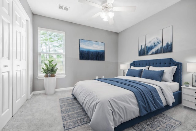 bedroom featuring a closet, ceiling fan, and carpet