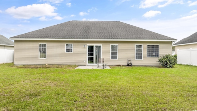 back of house featuring a yard