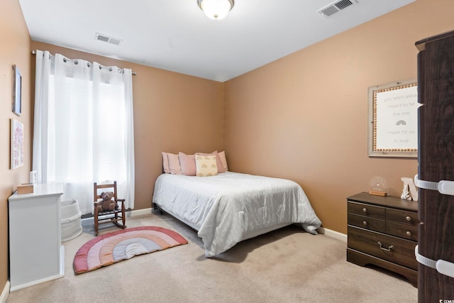 bedroom featuring light carpet