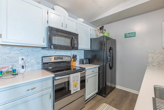 kitchen featuring a textured ceiling, dark wood-type flooring, light countertops, backsplash, and black appliances