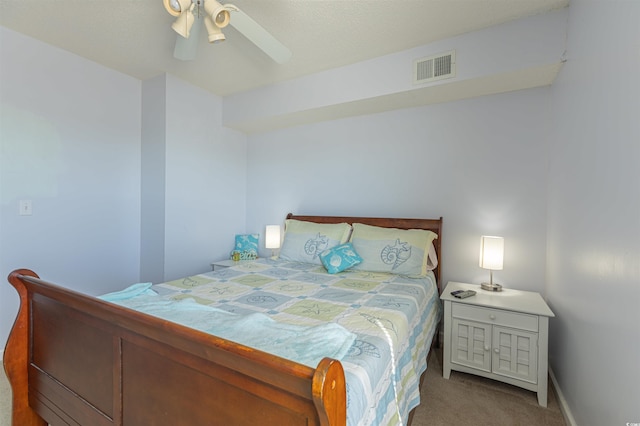 bedroom featuring carpet floors, visible vents, and a ceiling fan