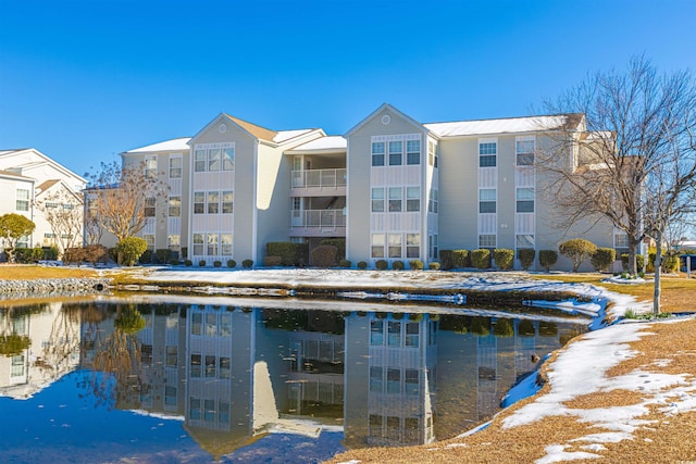 view of building exterior with a water view