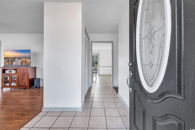 foyer with light tile patterned floors