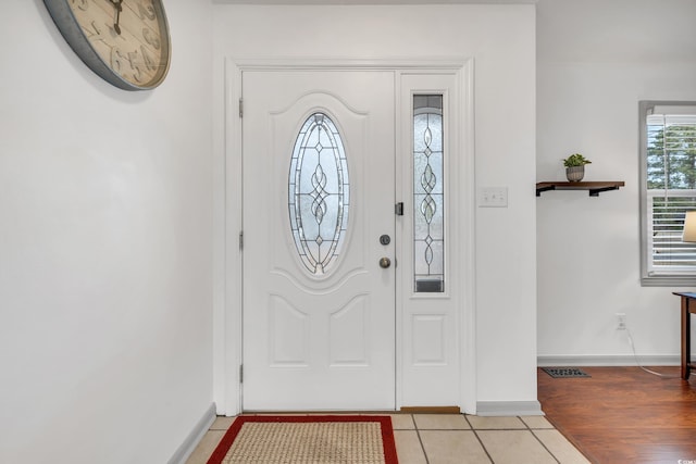 entrance foyer featuring light tile patterned flooring