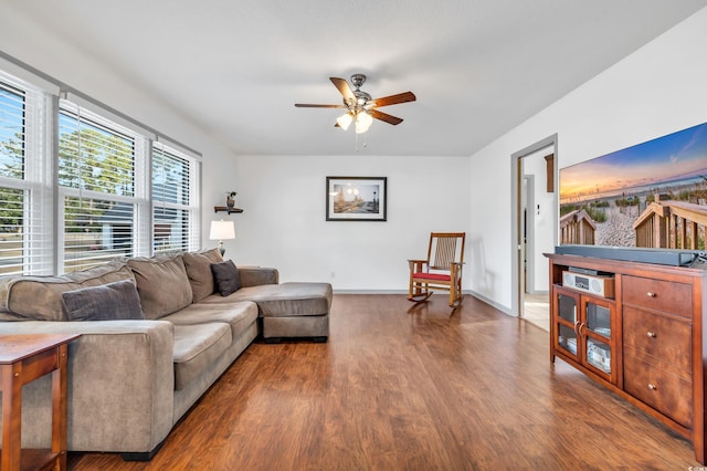 living room with wood-type flooring and ceiling fan