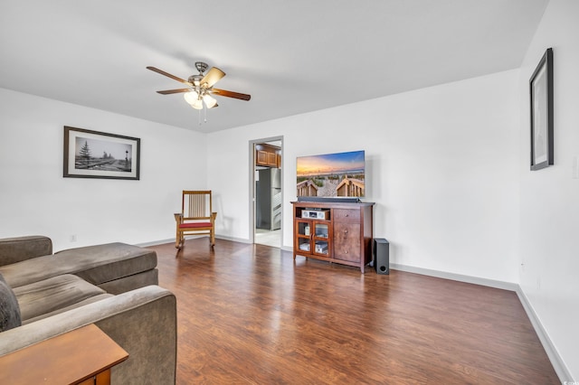 living room with dark hardwood / wood-style floors and ceiling fan