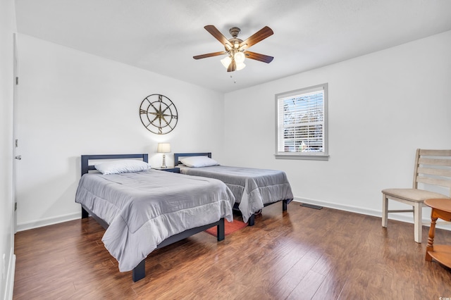 bedroom featuring dark hardwood / wood-style floors and ceiling fan