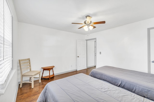 bedroom featuring dark wood-type flooring and ceiling fan