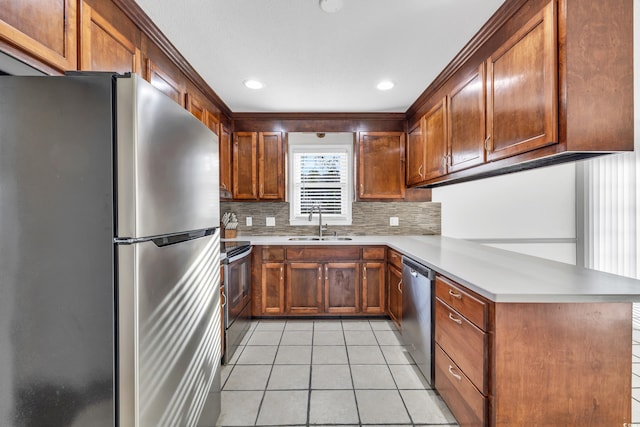 kitchen featuring light tile patterned flooring, sink, appliances with stainless steel finishes, kitchen peninsula, and backsplash