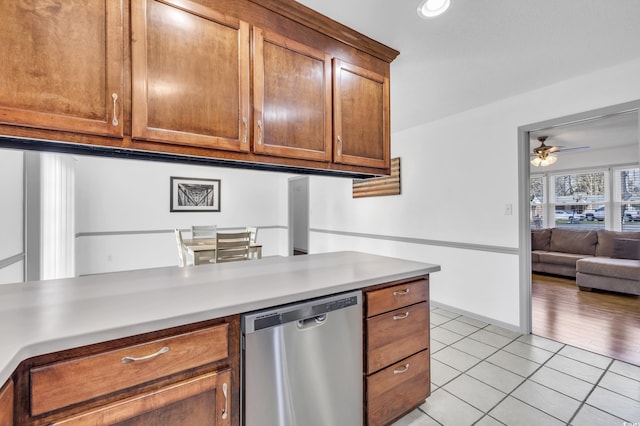 kitchen featuring dishwasher, light tile patterned flooring, and ceiling fan