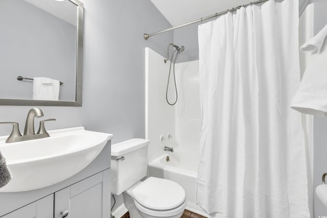 full bathroom featuring vanity, shower / bathtub combination with curtain, and toilet