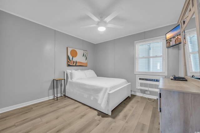 bedroom featuring crown molding, a wall mounted AC, ceiling fan, and light hardwood / wood-style flooring