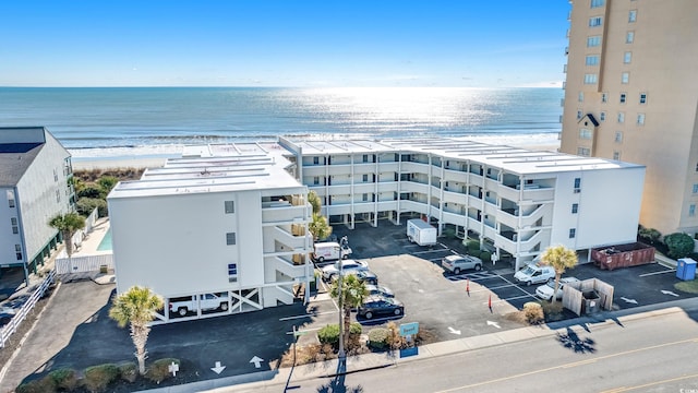 bird's eye view featuring a view of the beach and a water view