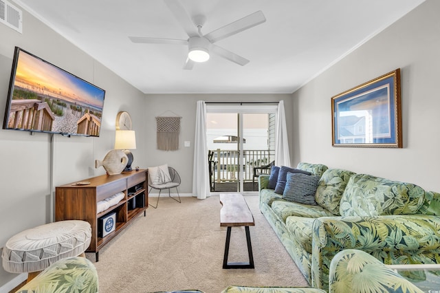 carpeted living room featuring ceiling fan