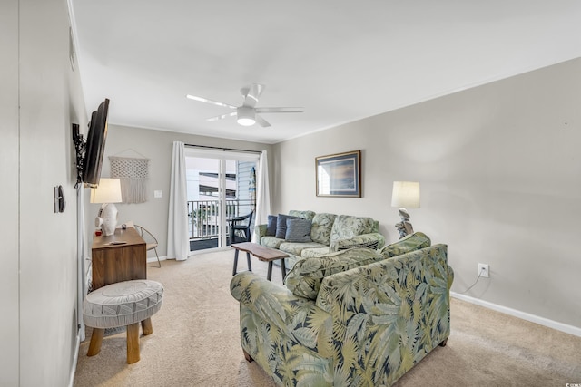 carpeted living room with ceiling fan