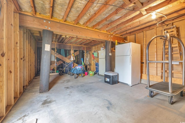 basement featuring white refrigerator