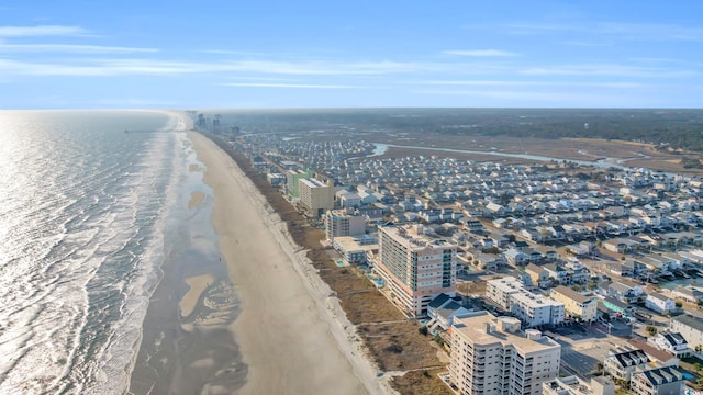 drone / aerial view featuring a view of the beach and a water view