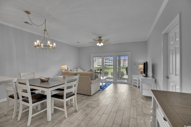 4200 Coquina Harbour Dr Unit H3, Little River, SC 29566 - dining area with a textured ceiling, light wood-style flooring, ceiling fan, a chandelier, and ornamental molding